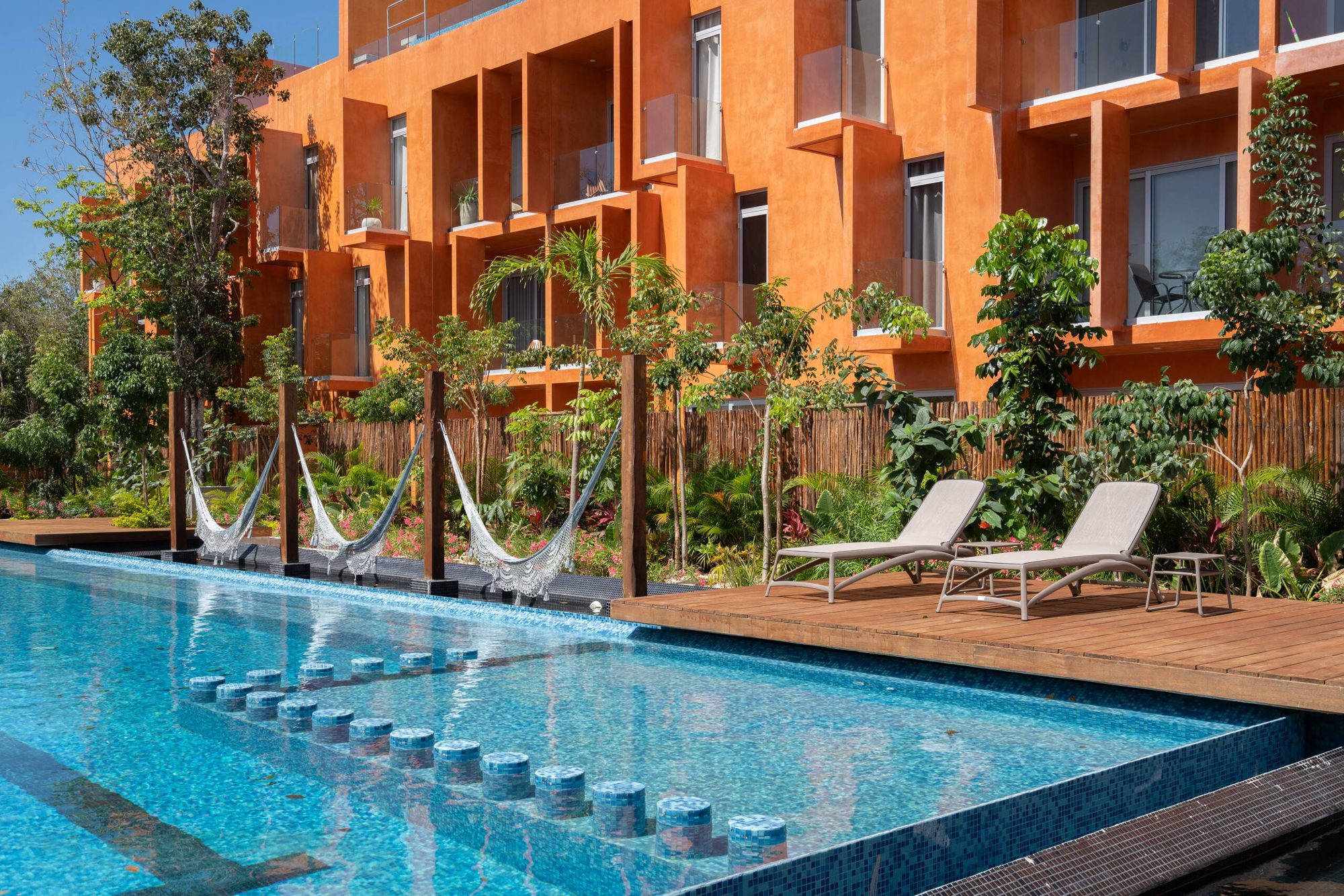 Pool with in-water steps, hammocks and loungers