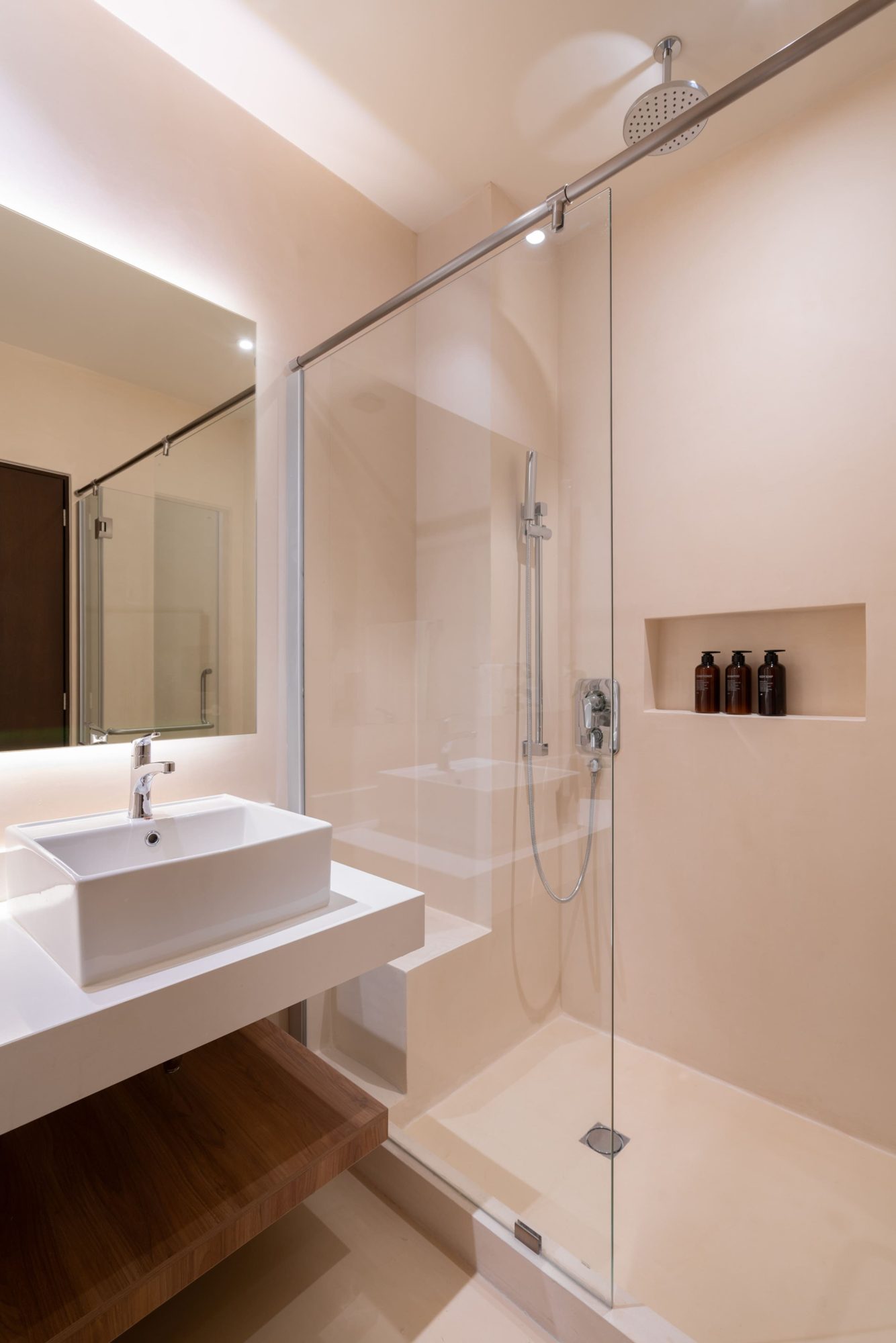 Bathroom with a glass walk-in shower and vessel sink