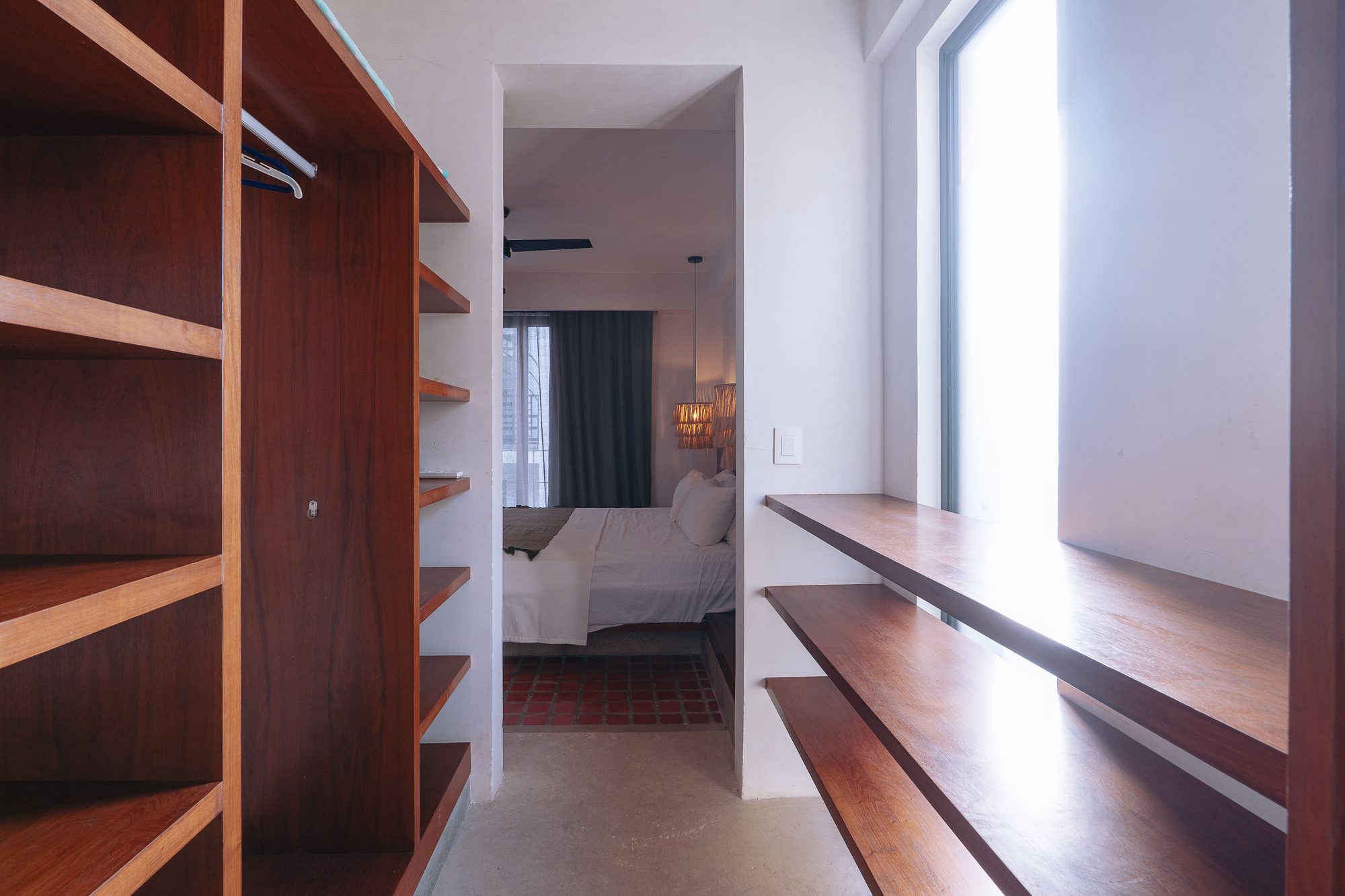 Closet with wooden shelving and hanging space